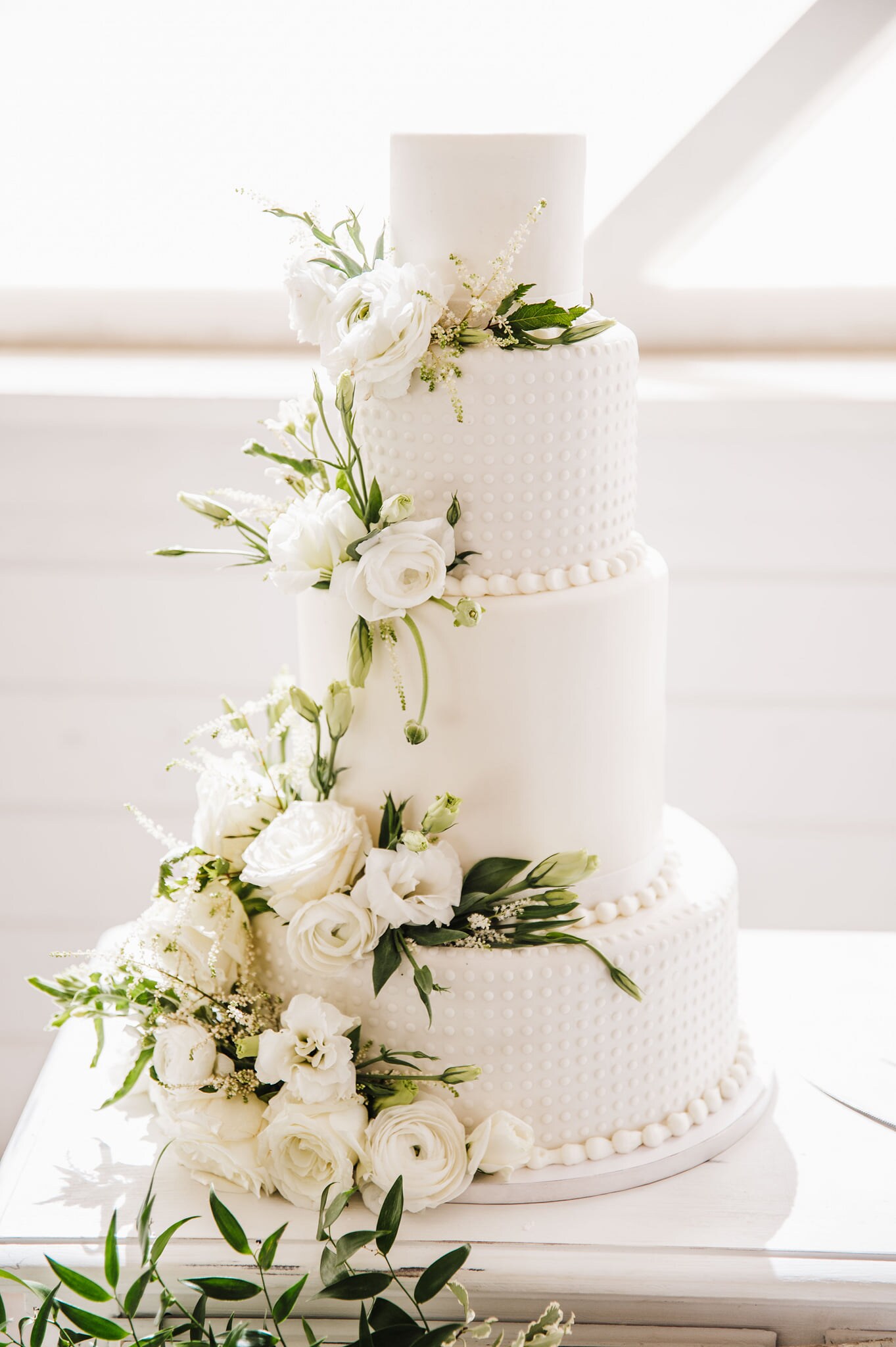 Fresh Flowers on White Wedding Cake